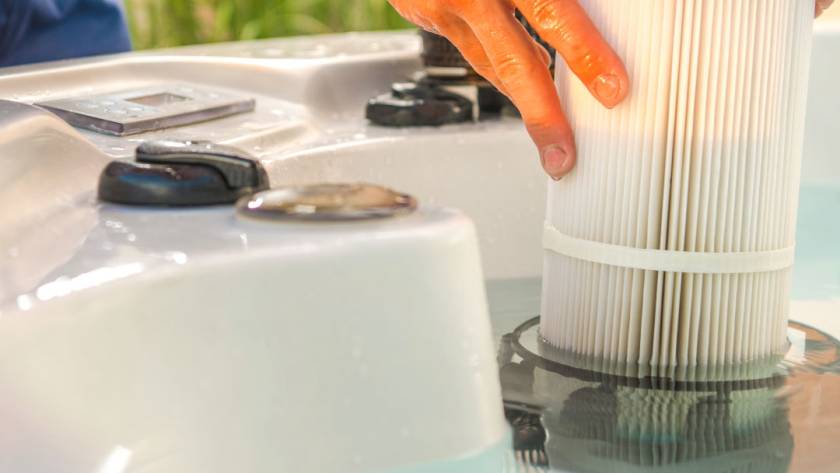 Man installing a hot tub water filter